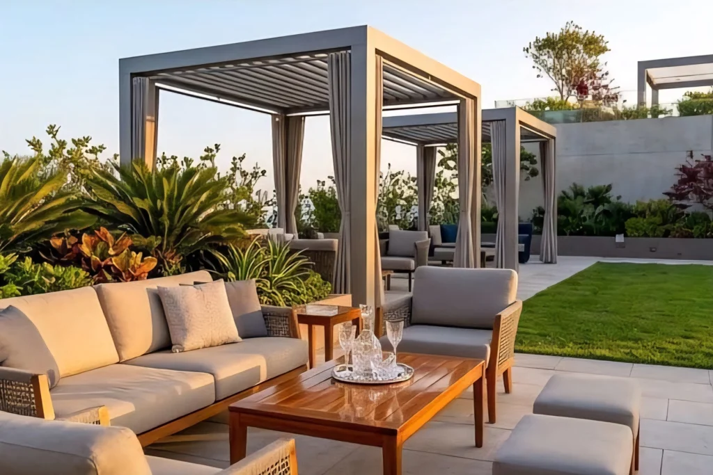 A rooftop terrace with sofas beneath pergolas and planted borders