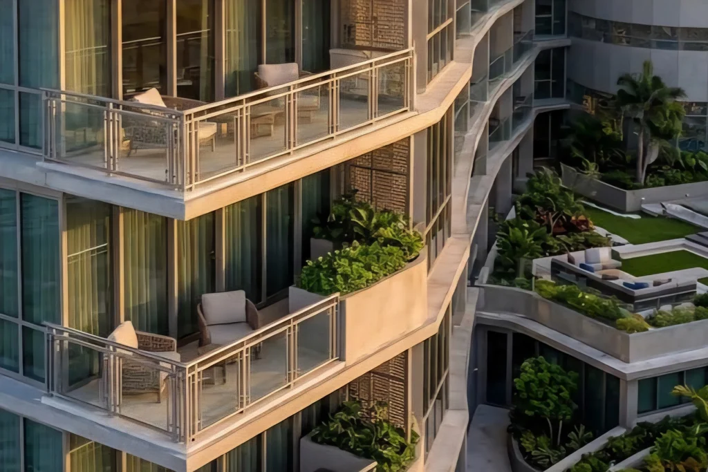 Residential balconies and planted terraces along the curved facade